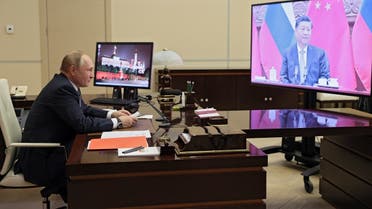 Russian President Vladimir Putin holds a meeting with Chinese President Xi Jinping via a video link at the Novo-Ogaryovo state residence outside Moscow on December 15, 2021. (AFP/Sputnik/Mikhail Metzel)