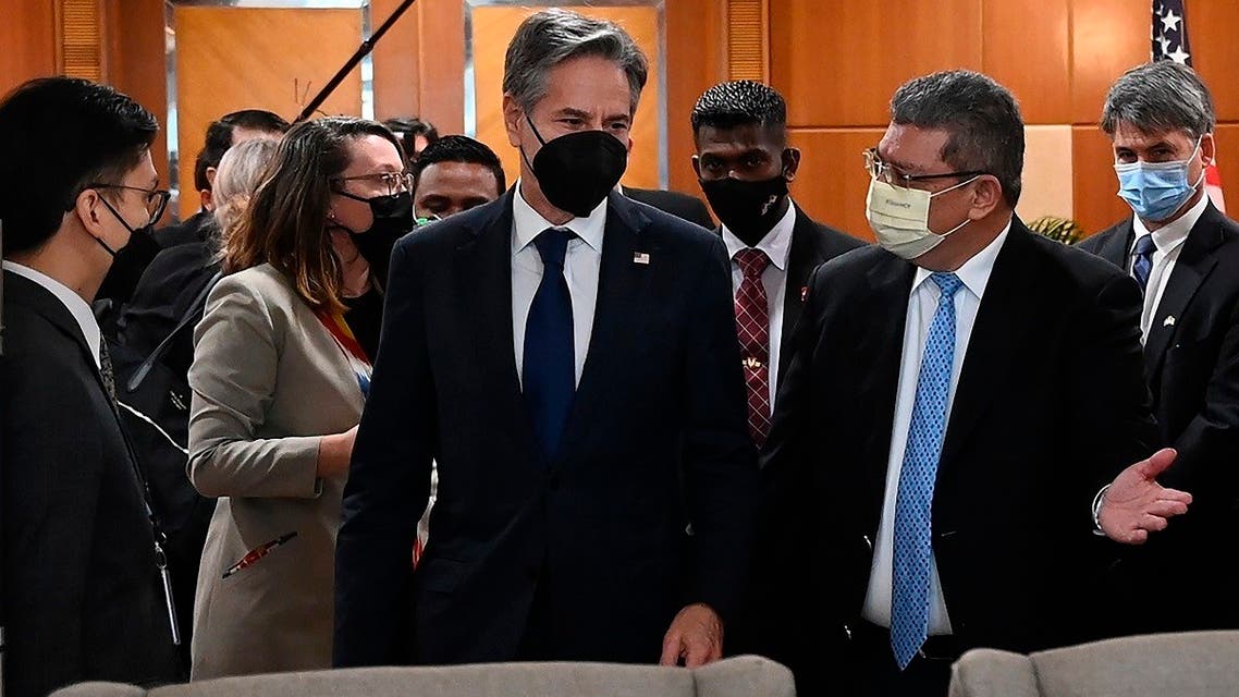 US Secretary of State Antony Blinken, center, is welcomed by Malaysian Foreign Minister Saifuddin Abdullah, right, at foreign ministry in Putrajaya, Malaysia, Dec. 15, 2021. (Jai Huzaini/Ministry of Foreign Affair via AP)
