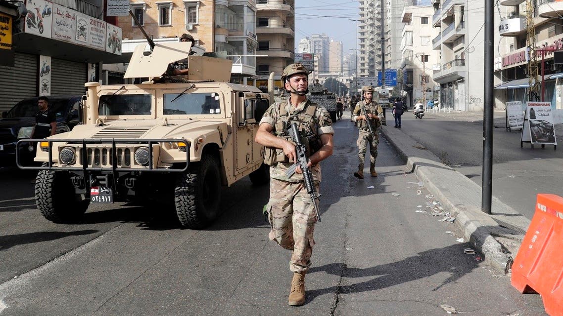 Lebanese Army soldiers patrol the clashes area in the southern suburb of the capital Beirut, on October 14, 2021. (AFP)