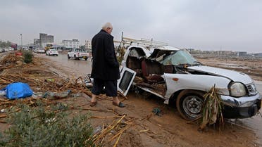 A resident inspects the damage in the area of Daratu, on the outskirts of Arbil, the capital of the northern Iraqi Kurdish autonomous region, on December 17, 2021, after flash floods caused by torrential rains left eight people dead. (AFP)