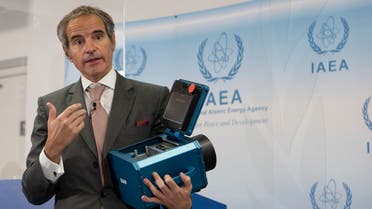 Director General of the International Atomic Energy Agency (IAEA) Rafael Mariano Grossi presents a surveillance camera at the agency's headquarters in Vienna, Austria, on December 17, 2021. (AFP)