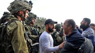 Palestinians of the West Bank confront Israeli soldiers on Dec. 17, 2021. (AFP)