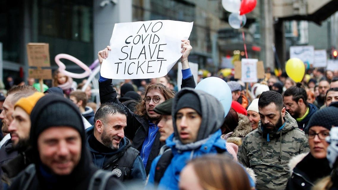 People attend a demonstration against the Belgian government's restrictions imposed to contain the spread of the coronavirus in Brussels, Belgium, on December 19, 2021. (Reuters)
