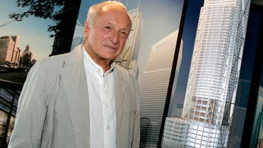 Architect Richard Rogers of Britain poses with a model of the building he designed for the World Trade Center site in New York, September 7, 2006. (Reuters)