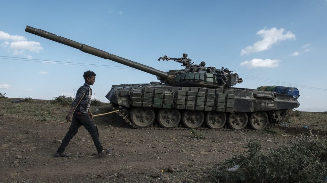 A shepherd walks in front of an abandoned tank belonging to Tigrayan forces, south of the town of Mehoni, Ethiopia. (File Photo: AFP)