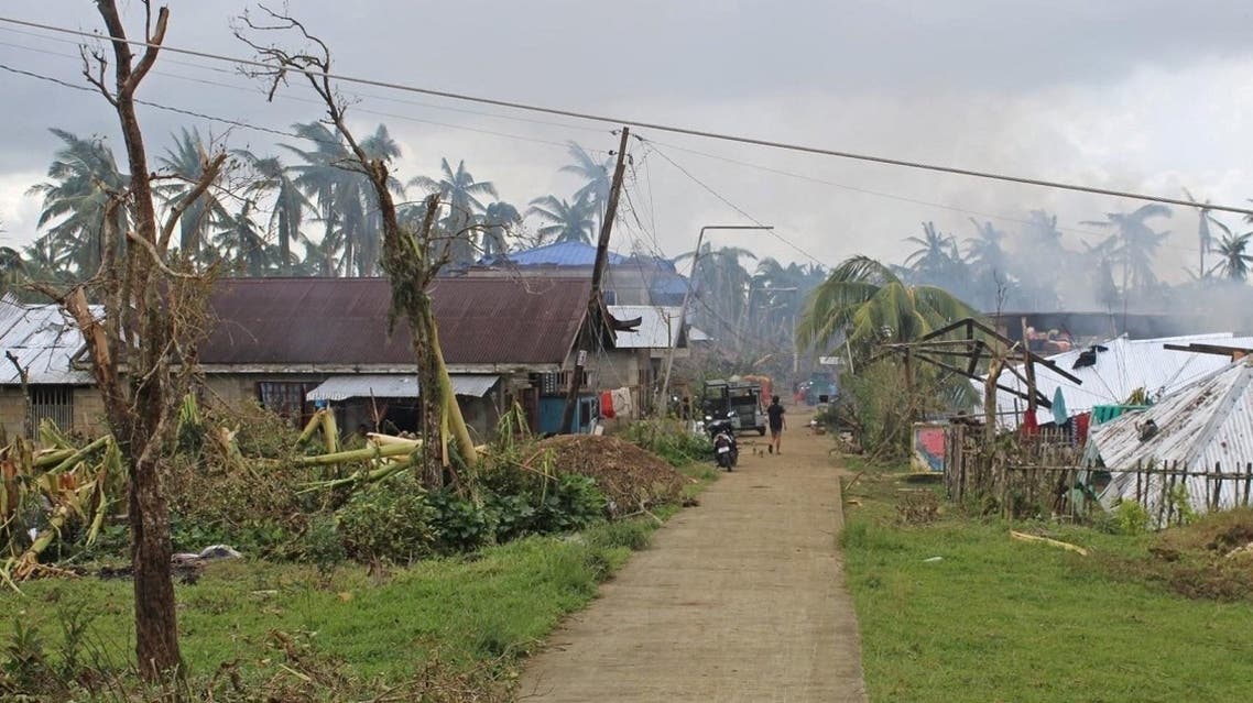 Houses and trees damaged by typhoon Rai are seen, in Surigao del Norte province, Philippines, on December 18, 2021. (Reuters)