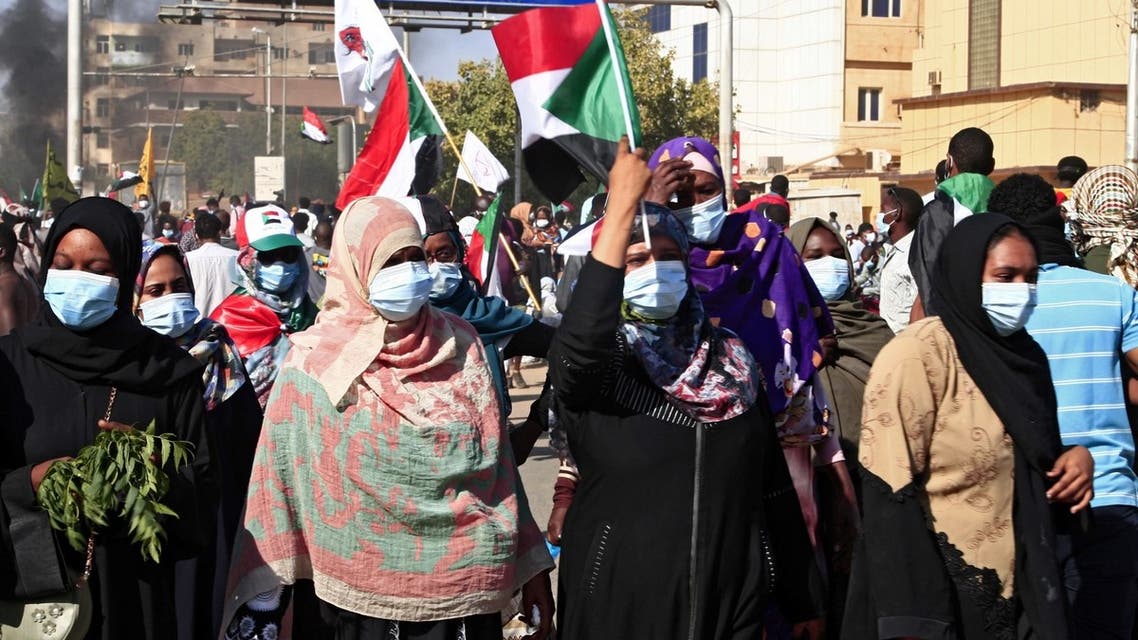 Sudanese protesters rally to mark three years since the start of mass demonstrations that led to the ouster of strongman Omar al-Bashir, near the Presidential palace in the capital Khartoum on December 19, 2021. (AFP)