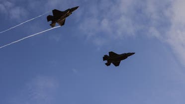 F-35 fighter jets perform in an air show at the graduation ceremony of Israeli pilots at the Hatzerim air force base in the Negev desert near the southern Israeli city of Beersheva, on December 22, 2021. (AFP)