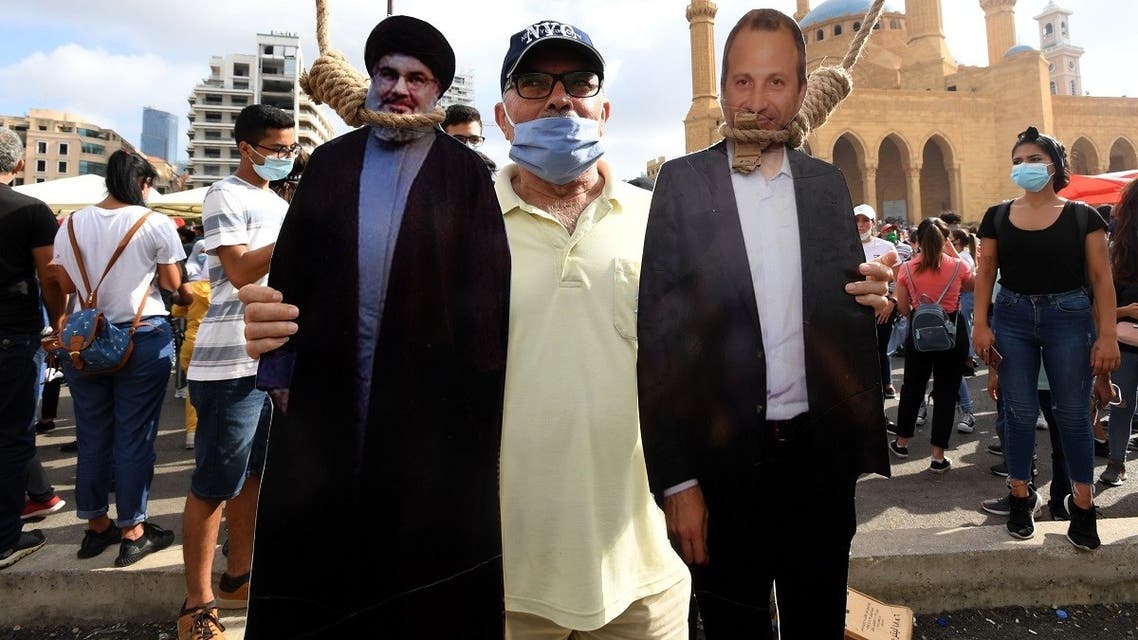 A cut-out of Hassan Nasrallah (L), Hezbollah’s secretary-general, and MP Gebran Bassil in downtown Beirut on Aug. 8, 2020. (AFP)