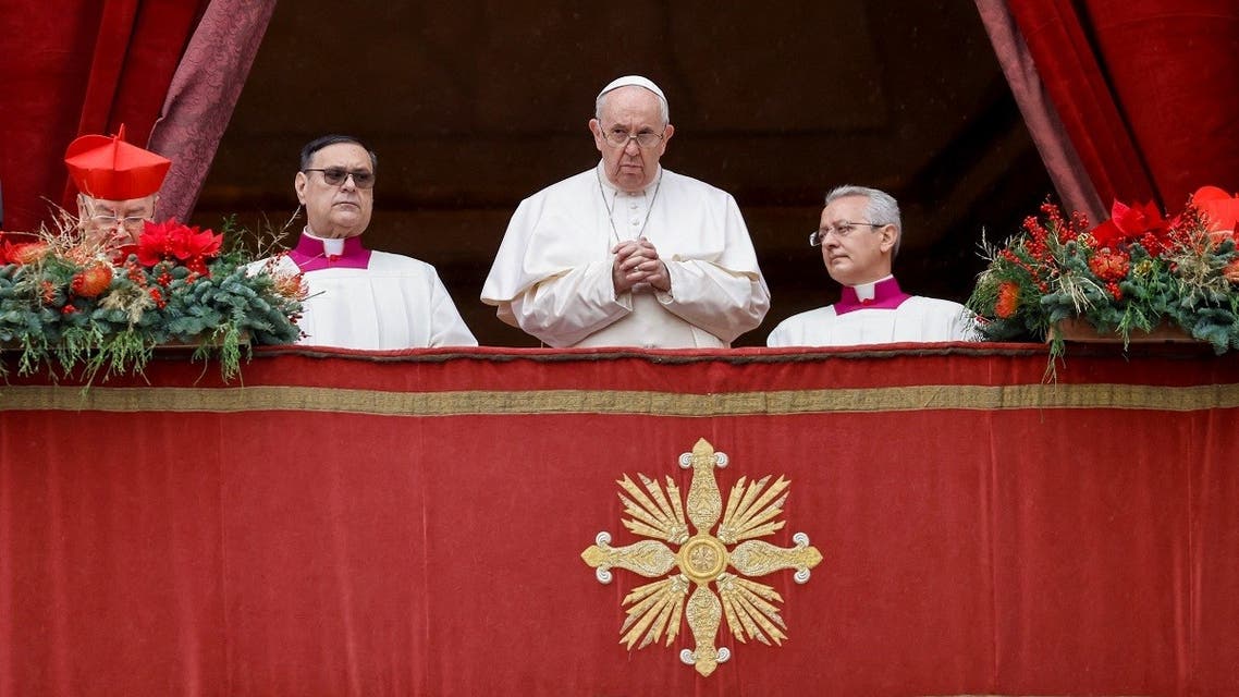 Pope Francis stands on the main balcony of St. Peter's Basilica to deliver his traditional Christmas Day Urbi et Orbi speech to the city and the world from the Vatican, on December 25, 2021. (Reuters)