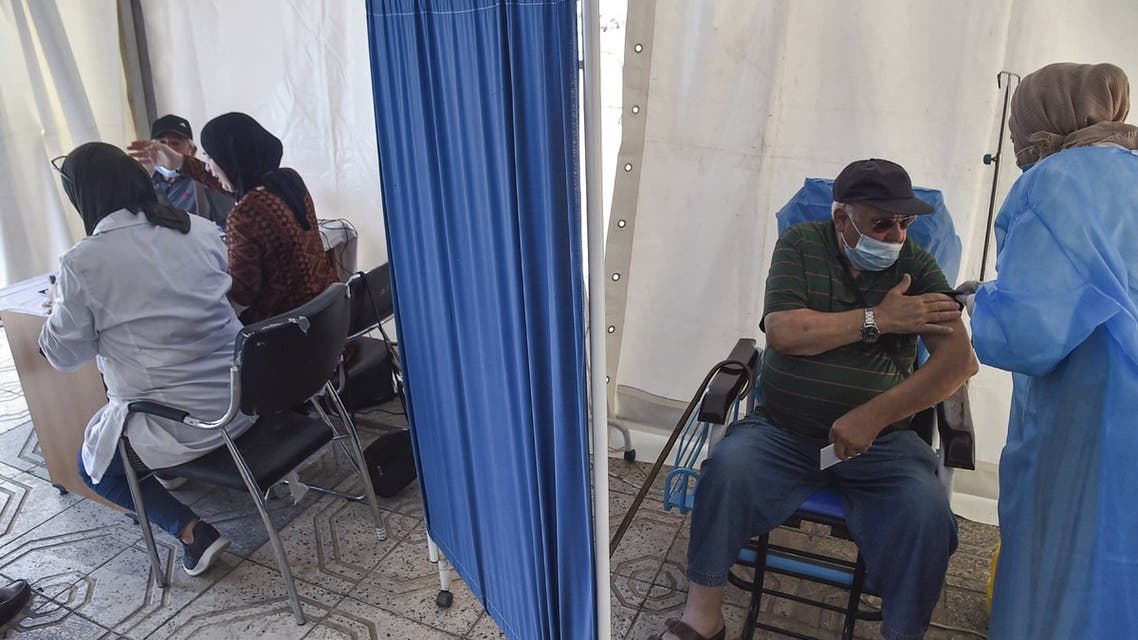 People receive doses of the Oxford AstraZeneca COVID-19 coronavirus vaccine at a walk-in vaccination centre in the Bab el-Oued district of Algeria's capital Algiers on June 7, 2021. (AFP)