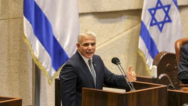 Israeli Foreign Minister Yair Lapid speaks during a plenum session and vote on the state budget at the assembly hall in the Knesset (Israeli parliament), in Jerusalem on November 3, 2021. (AFP)
