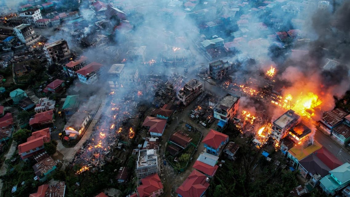 This aerial photo taken on October 29, 2021 show smokes and fires from Thantlang, in Chin State, where more than 160 buildings have been destroyed caused by shelling from Junta military troops, according to local media. (AFP)