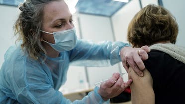 In this file photo taken on March 13, 2021 a member of the medical staff vaccinates a patient at a Covid-19 vaccination centre, located at the Conference centre in Nice. (AFP)