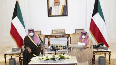 In this photo released by Kuwait News Agency, KUNA, Emir of Kuwait, Sheikh Nawaf Al Ahmad Al Sabah, right, receives Prime Minister, Sheikh Sabah Al-Khaled Al Hamad Al Sabah, in Kuwait, Tuesday, Dec. 28, 2021. Kuwait's ruling emir announced the formation of a new Cabinet on Tuesday, breaking a monthlong deadlock with the nomination of 15 new government ministers who will have to address a series of political and financial difficulties. The new Cabinet represents the Gulf Arab state's fourth government over the last year and a half alone. ( KUNA via AP)