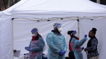 A local resident is tested for COVID-19 at a free testing site at Farragut Square as coronavirus cases surge in the city on December 21, 2021 in Washington, DC. (AFP)