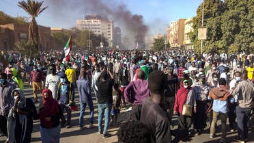 Sudanese demonstrators take to the streets of the capital Khartoum as tens of thousands protest against the army's October 25 coup, Dec. 30, 2021. (AFP)