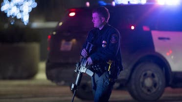 A police officer at the scene where two people were shot and wounded following an altercation at the Mall of America, sending New Year’s Eve shoppers scrambling for safety and placing the Minneapolis mall on temporary lockdown. (AP)