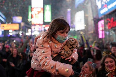 A child attends the New Year's celebrations in Times Square, as the Omicron coronavirus variant continues to spread, in the Manhattan borough of New York City, US, on January 1, 2022. (Reuters)