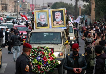 عناصر لميليشيات موالية لإيران تجوب شوارع بغداد بصور سليماني والمهندس