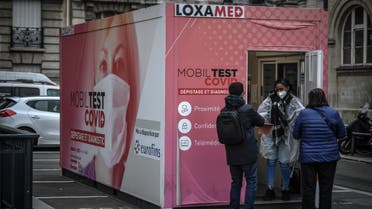 Patients wait to be tested for the novel coronavirus Covid-19 on December 23, 2021 in Paris. (AFP)