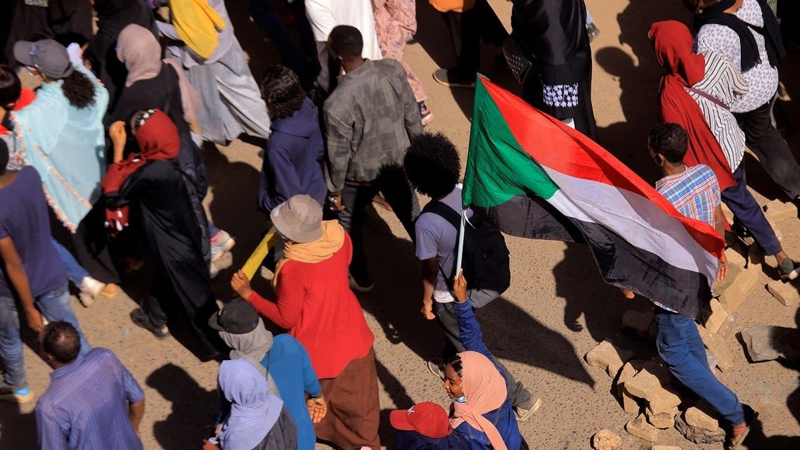 Protesters march during a rally against military rule following last month's coup in Khartoum, Sudan, on December 30, 2021. (Reuters)
