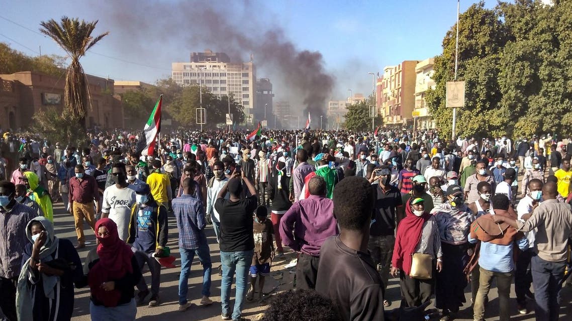Sudanese demonstrators take to the streets of the capital Khartoum as tens of thousands protest against the army's October 25 coup, on December 30, 2021. (AFP)