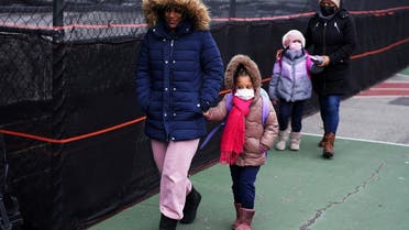Children arrive at Bronx Elementary School 385, during the coronavirus disease pandemic in New York, Jan. 3, 2022. (Reuters)