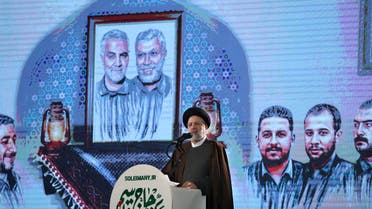 Iranian President Ebrahim Raisi delivers a speech during a ceremony in the capital Tehran, on January 3, 2022, commemorating the second anniversary of the killing in Iraq of Iranian commander Qasem Soleimani and Iraqi commander Abu Mahdi al-Muhandis in a US raid. (AFP)