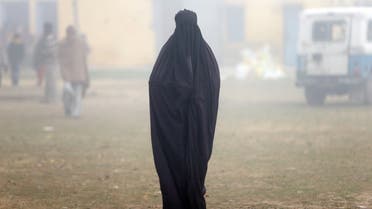A woman wearing a burka leaves a polling booth after voting during the state assembly election, in the town of Deoband, in the state of Uttar Pradesh, India, February 15, 2017. REUTERS/Cathal McNaughton TPX IMAGES OF THE DAY