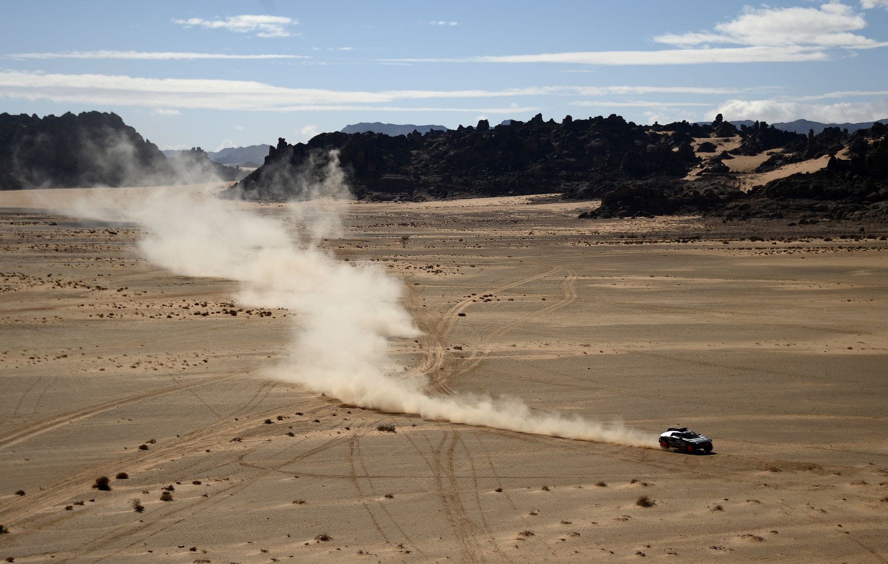 Audi's electric Spanish driver Carlos Sainz and co-driver Lucas Cruz of Spain compete during Stage 1B of the Dakar Rally 2022 around the Saudi city of Hail, on January 2, 2022. (AFP)
