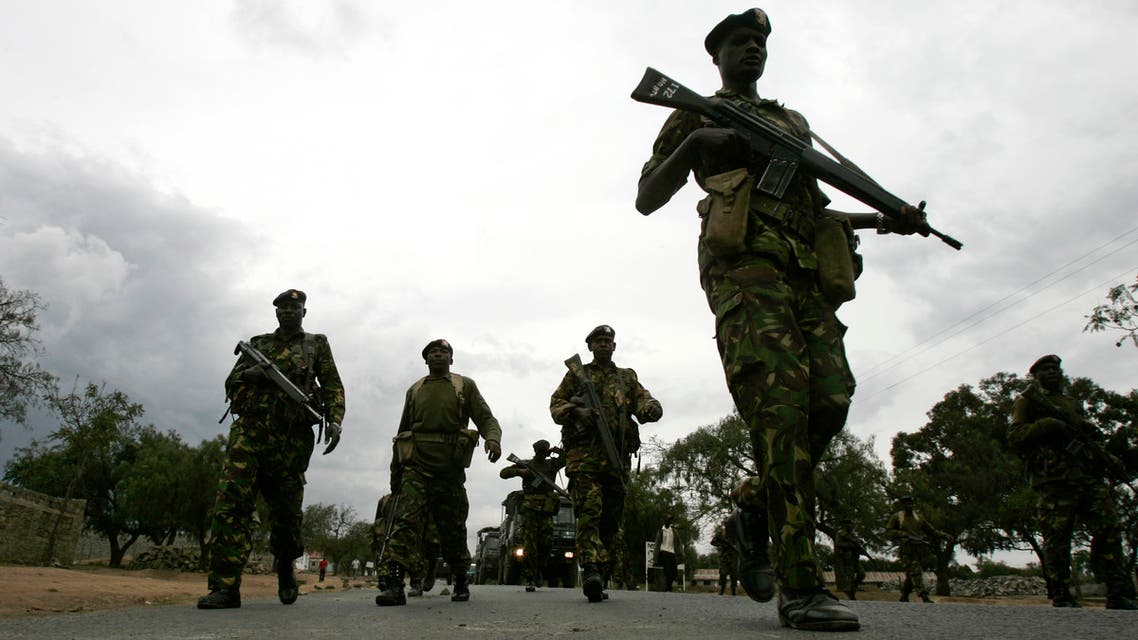 Kenyan Army soldiers patrol the centre of the town of Naivasha January 27, 2008. At least 10 people were killed in ethnic fighting in the Kenyan town of Naivasha on Sunday as rival tribal gangs set fire to homes and blocked roads. REUTERS/Peter Andrews (KENYA)