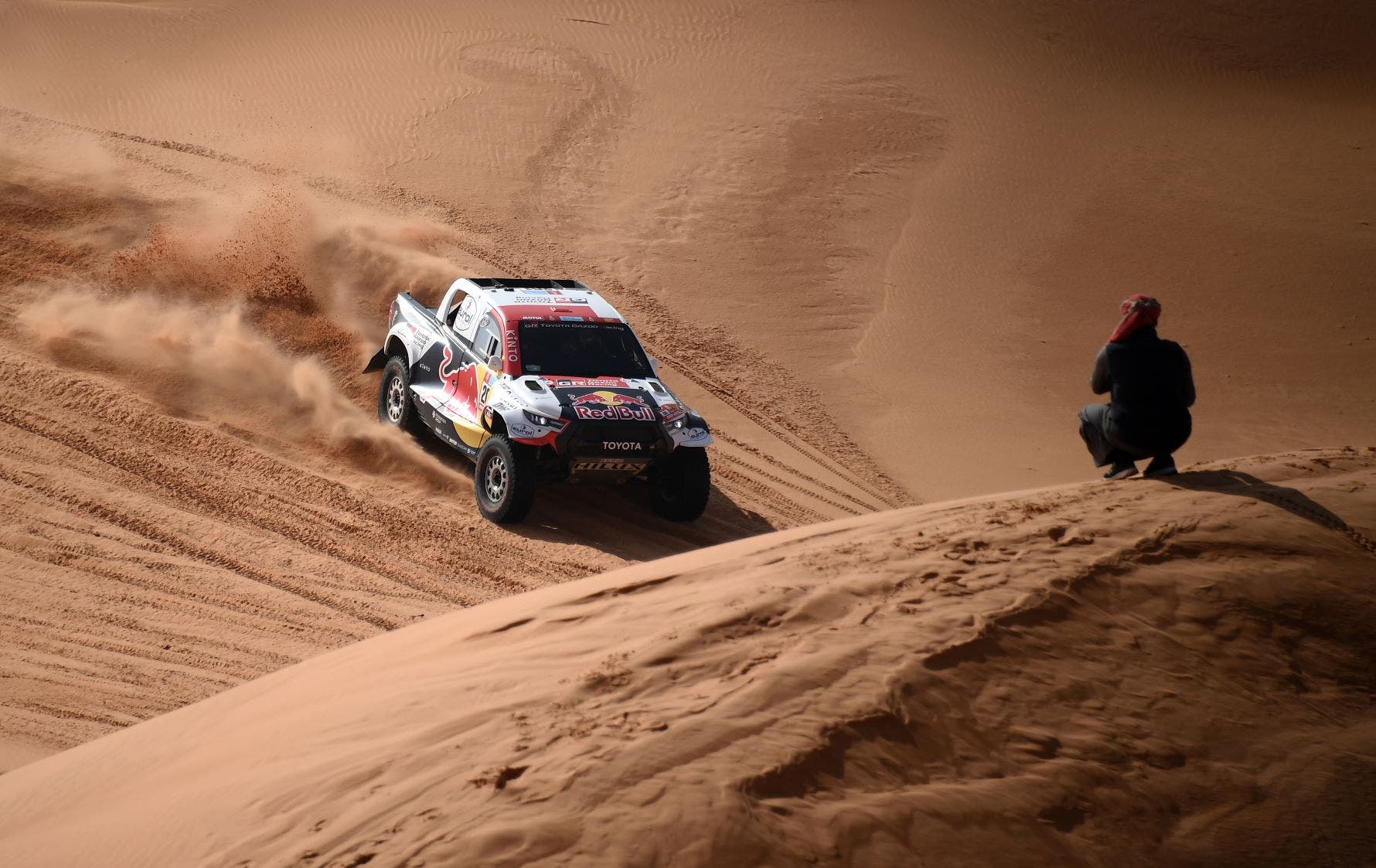 Toyota's driver Nasser Al-Attiyah of Qatar and his co-driver Mathieu Baumel of France compete during Stage 3 of the Dakar Rally 2022 between the Saudi areas of al-Artawiya and al-Qaysumah, on January 4, 2022. (AFP)
