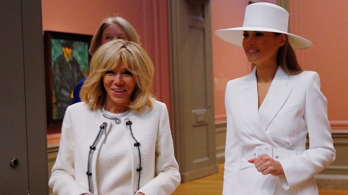 United States first lady Melania Trump and her French counterpart Brigitte Macron visit an exhibit of Cezanne paintings during a tour of the National Gallery of Art in Washington, US, , on April 24, 2018. (Reuters)