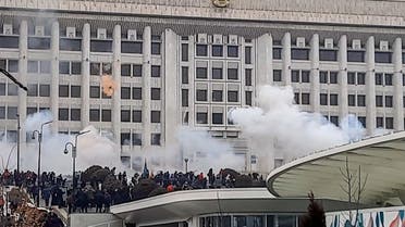 This image grab shows protesters near an administrative building during a rally over a hike in energy prices in Almaty on January 5, 2022. (AFP)