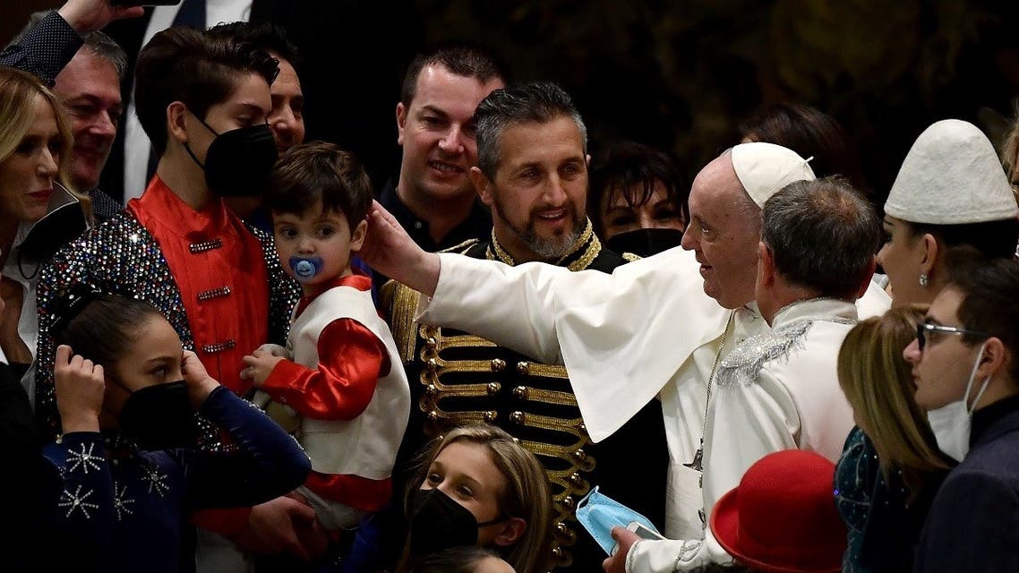 Pope Francis (C) meets members of the Rony Roller Circus during his general audience at the Paul VI Hall at the Vatican on January 5, 2022. (Filippo Monteforte/AFP)