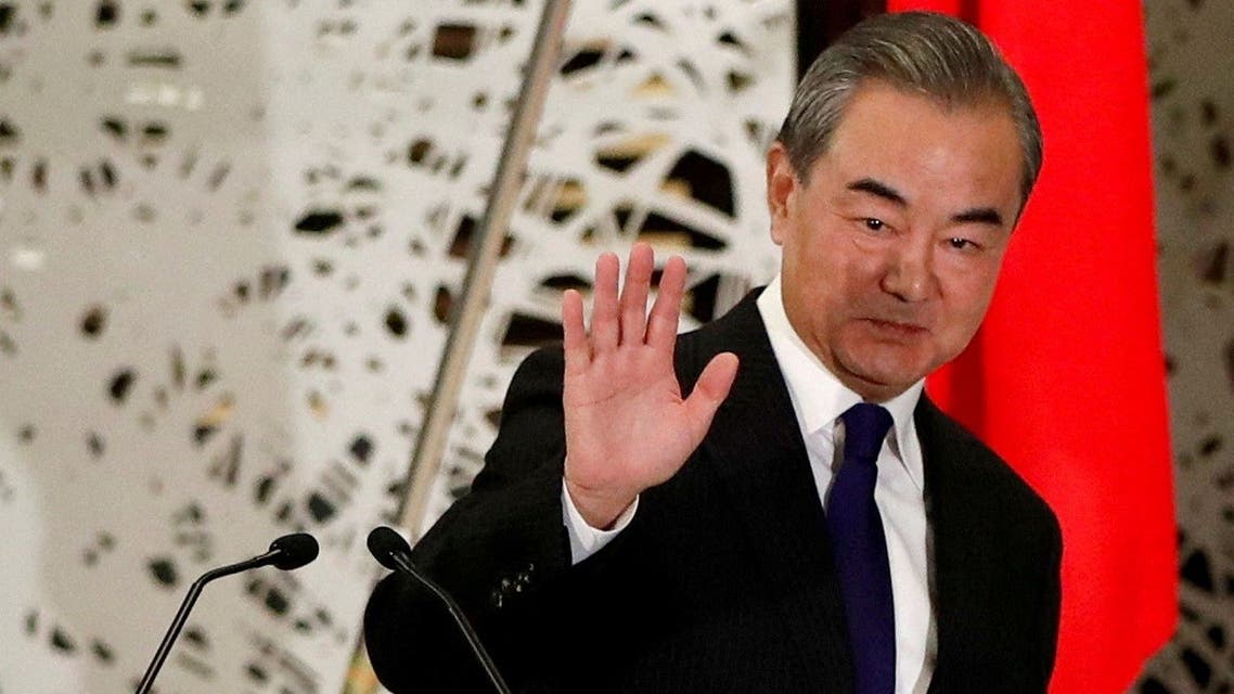 China's Wang Yi, state councillor and foreign minister, waves as he leaves a news conference in Tokyo, Japan, on November 24, 2020. (Reuters)
