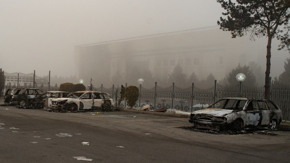 A picture shows burnt-out cars at a parking area near administrative buildings in central Almaty on January 6, 2022, after violence that erupted following protests over hikes in fuel prices. (AFP)