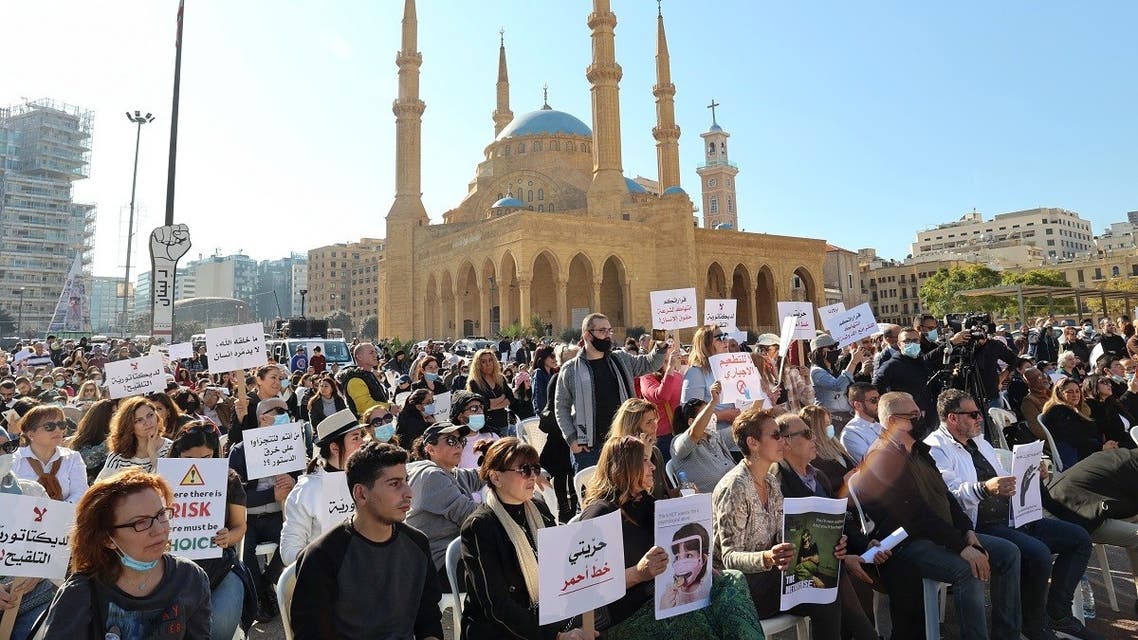 Lebanese protest against the mandatory Covid-19 vaccine pass in the centre of Lebanon's capital Beirut, near the Mosque of Mohammed al-Amin, on January 8, 2022. (AFP)