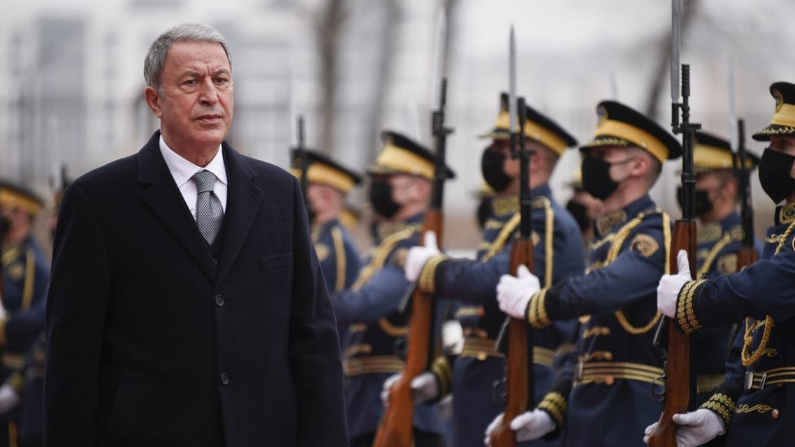 Turkish Defense Minister Hulusi Akar reviews Kosovo's honor guard upon his arrival in Pristina on December 28, 2021. (AFP)