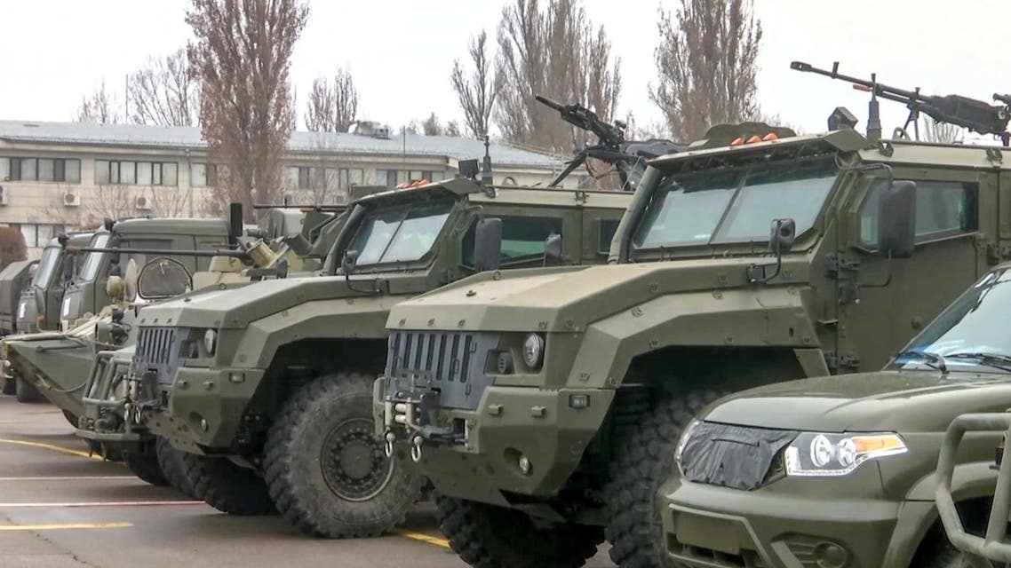 This handout picture taken and released by the Russian Defence Ministry on January 9, 2022 shows Russian military vehicles parked at an airfield after a military cargo plane landing in Almaty, Kazakhstan. (AFP)