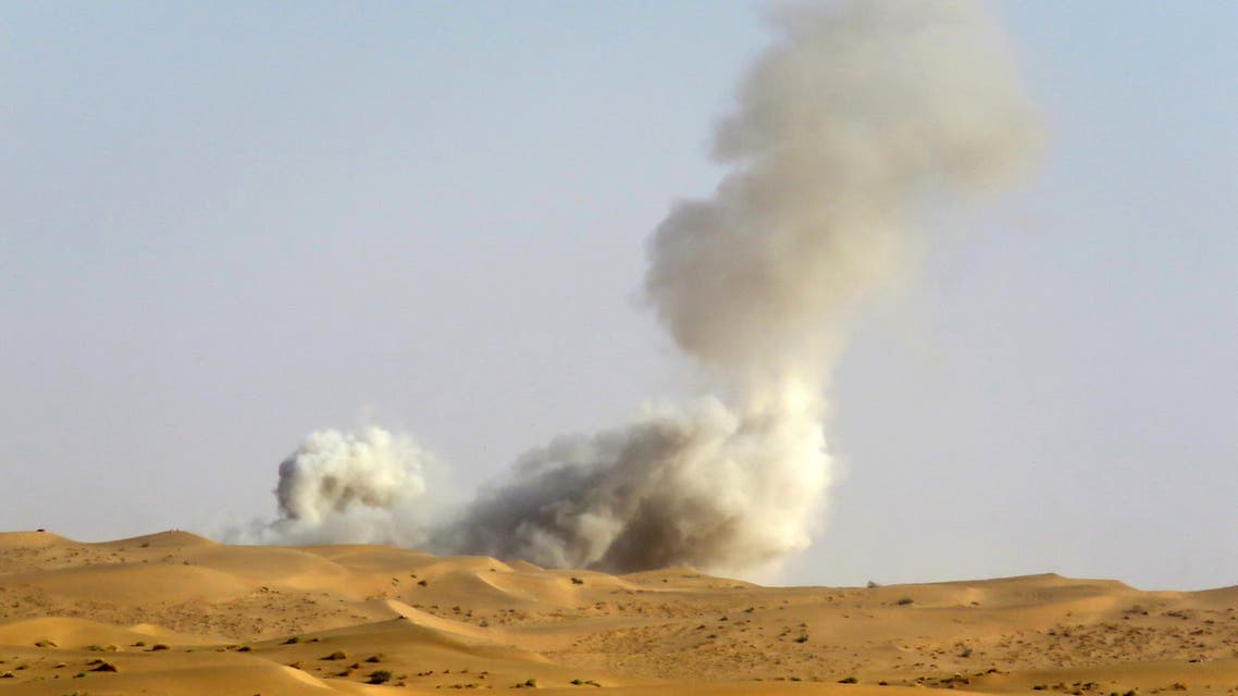 This picture taken from a position held by Yemeni pro-government fighters, shows heavy smoke billowing behind the frontline with Huthi rebels, in the south of the strategic governorate of Marib, on January 4, 2021. Government forces and the Huthi rebels have been locked for months in a fierce battle for Marib, the government's last stronghold and capital of the northern oil-rich province of the same name. (Photo by AFP)