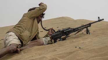 A Yemeni pro-government fighter mans a position during fighting with Huthi rebels in the south of the strategic governorate of Marib, on January 5, 2021. Government forces and the Huthi rebels have been locked for months in a fierce battle for Marib, the government's last stronghold and capital of the northern oil-rich province of the same name. (Photo by AFP)