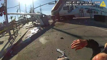 Police officers rescue a pilot whose plane crashed on train tracks in California. (Twitter)