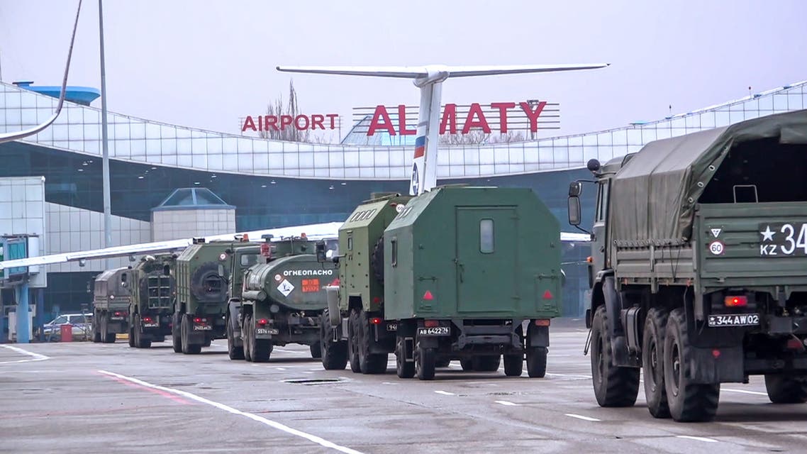TOPSHOT - This handout picture taken and released by the Russian Defence Ministry on January 9, 2022 shows Russian military vehicles moving along an airfield after a military cargo plane landing in Almaty, Kazakhstan. More than 5,000 people have been arrested in Kazakhstan over the riots that have shaken Central Asia's largest country in the last week, Kazakh authorities were quoted as saying January 9, 2022. In total, 5,135 people have been detained for questioning as part of 125 separate investigations into the unrest, according to the interior ministry quoted by local media. (Photo by Handout / Russian Defence Ministry / AFP) / RESTRICTED TO EDITORIAL USE - MANDATORY CREDIT AFP PHOTO / RUSSIAN DEFENCE MINISTRY  - NO MARKETING - NO ADVERTISING CAMPAIGNS - DISTRIBUTED AS A SERVICE TO CLIENTS - RESTRICTED TO EDITORIAL USE - MANDATORY CREDIT AFP PHOTO / Russian Defence Ministry  - NO MARKETING - NO ADVERTISING CAMPAIGNS - DISTRIBUTED AS A SERVICE TO CLIENTS