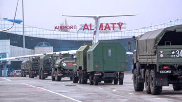 TOPSHOT - This handout picture taken and released by the Russian Defence Ministry on January 9, 2022 shows Russian military vehicles moving along an airfield after a military cargo plane landing in Almaty, Kazakhstan. More than 5,000 people have been arrested in Kazakhstan over the riots that have shaken Central Asia's largest country in the last week, Kazakh authorities were quoted as saying January 9, 2022. In total, 5,135 people have been detained for questioning as part of 125 separate investigations into the unrest, according to the interior ministry quoted by local media. (Photo by Handout / Russian Defence Ministry / AFP) / RESTRICTED TO EDITORIAL USE - MANDATORY CREDIT AFP PHOTO / RUSSIAN DEFENCE MINISTRY  - NO MARKETING - NO ADVERTISING CAMPAIGNS - DISTRIBUTED AS A SERVICE TO CLIENTS - RESTRICTED TO EDITORIAL USE - MANDATORY CREDIT AFP PHOTO / Russian Defence Ministry  - NO MARKETING - NO ADVERTISING CAMPAIGNS - DISTRIBUTED AS A SERVICE TO CLIENTS