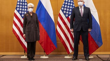 US Deputy Secretary of State Wendy Sherman (L) and Russian deputy Foreign Minister Sergei Ryabkov (R) pose for pictures as they attend security talks on soaring tensions over Ukraine, at the US permanent Mission, in Geneva, on January 10, 2022. (AFP)