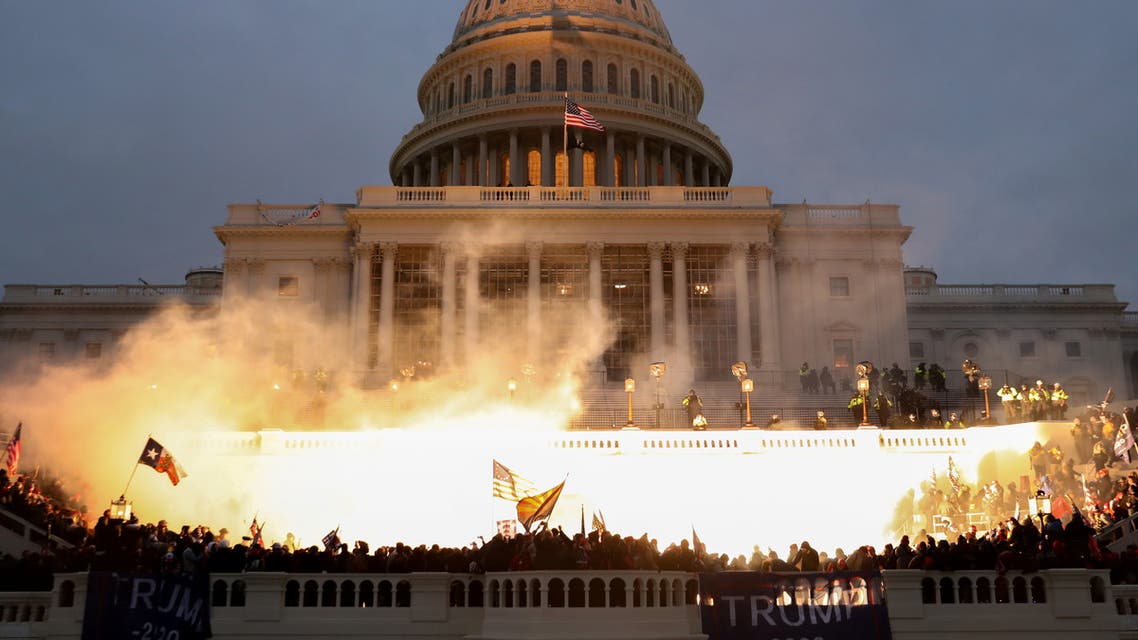 An explosion caused by a police munition is seen while supporters of U.S. President Donald Trump riot in front of the U.S. Capitol Building in Washington, U.S., January 6, 2021. REUTERS/Leah Millis TPX IMAGES OF THE DAY