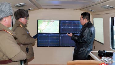 Picture taken on January 11, 2022 and released from North Korea's official Korean Central News Agency (KCNA) on January 12, 2022 shows North Korean leader Kim Jong Un (R) speaking with military officials during an observation of what state media says a hypersonic missile test-fire conducted by the Academy of Defence Science of the DPRK at an undisclosed location. (AFP)