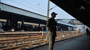 A file photo shows an Indian security official stands alert on a platform at New Delhi Railway Station in New Delhi on January 3, 2016. (AFP)